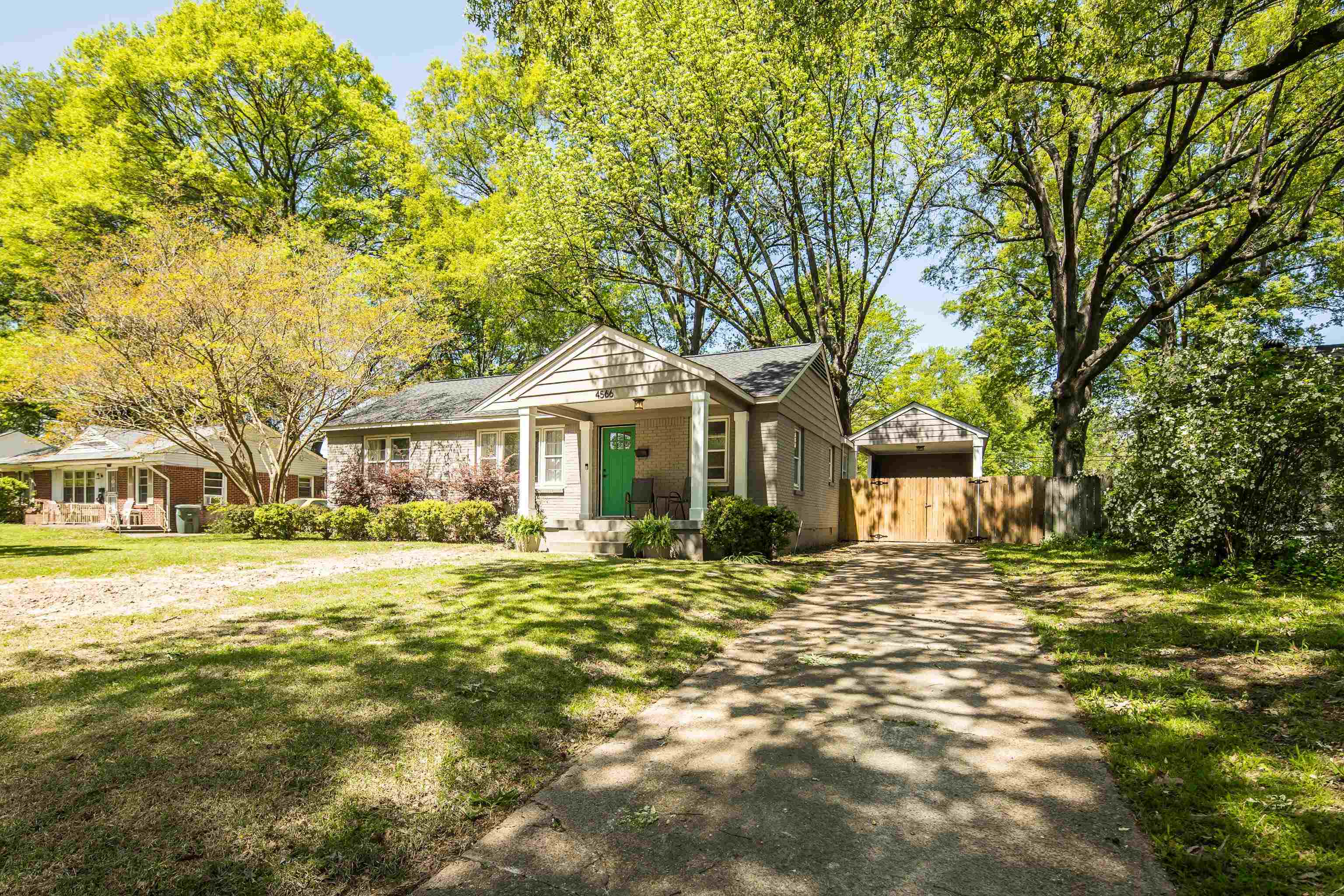 4566 Amboy Road Memphis, TN 38117 - Photo 3 of 29 a front view of a house with a garden