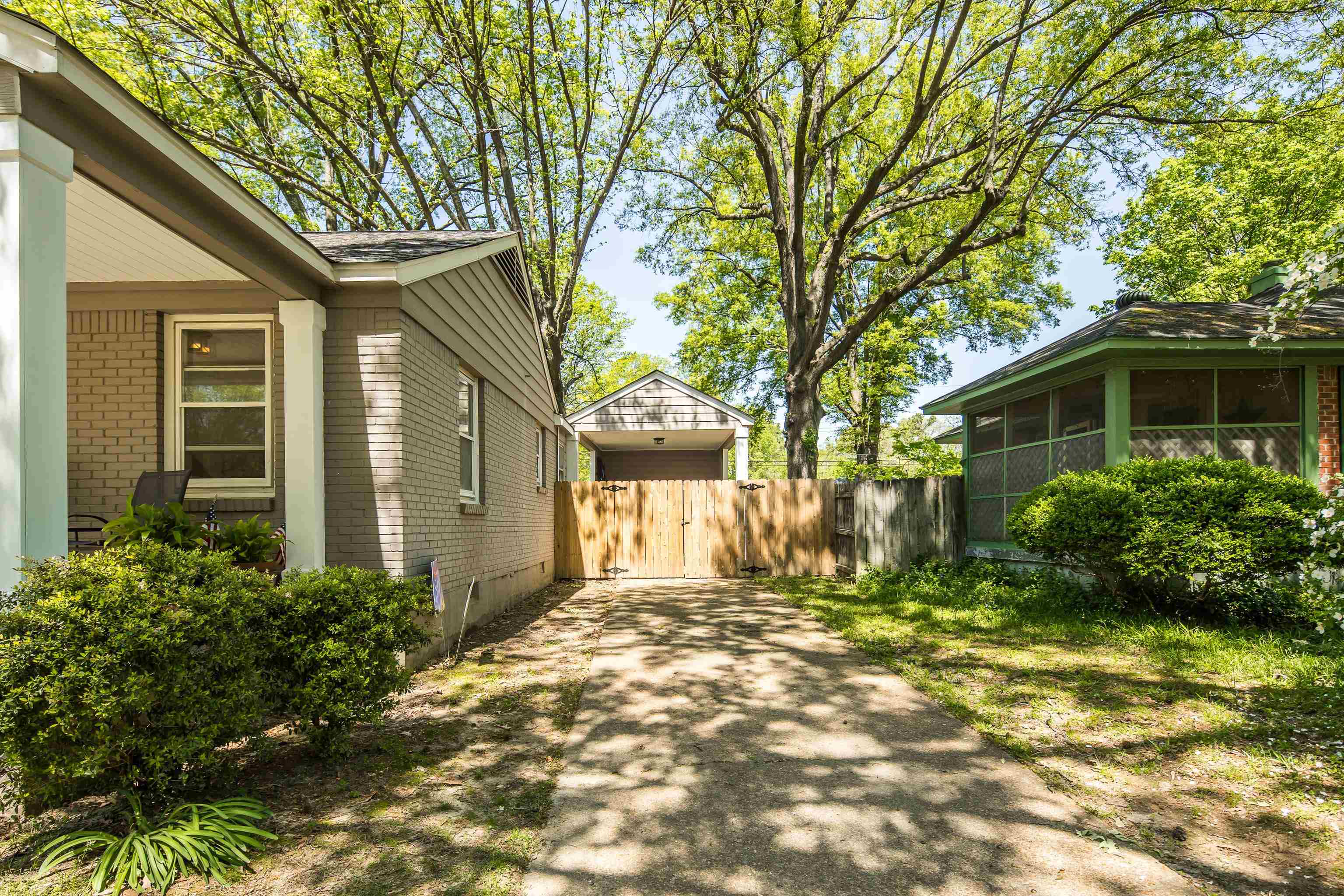 4566 Amboy Road Memphis, TN 38117 - Photo 4 of 29 a front view of a house with a yard
