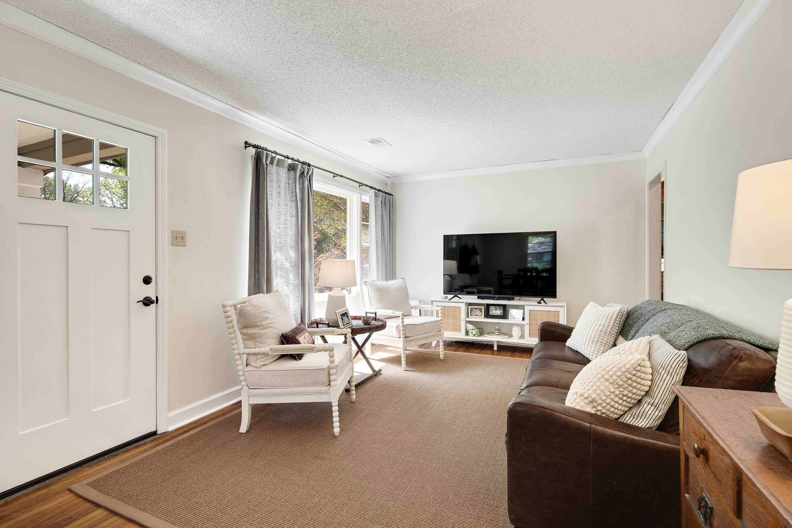 4566 Amboy Road Memphis, TN 38117 - Photo 6 of 29 a living room with furniture and a flat screen tv