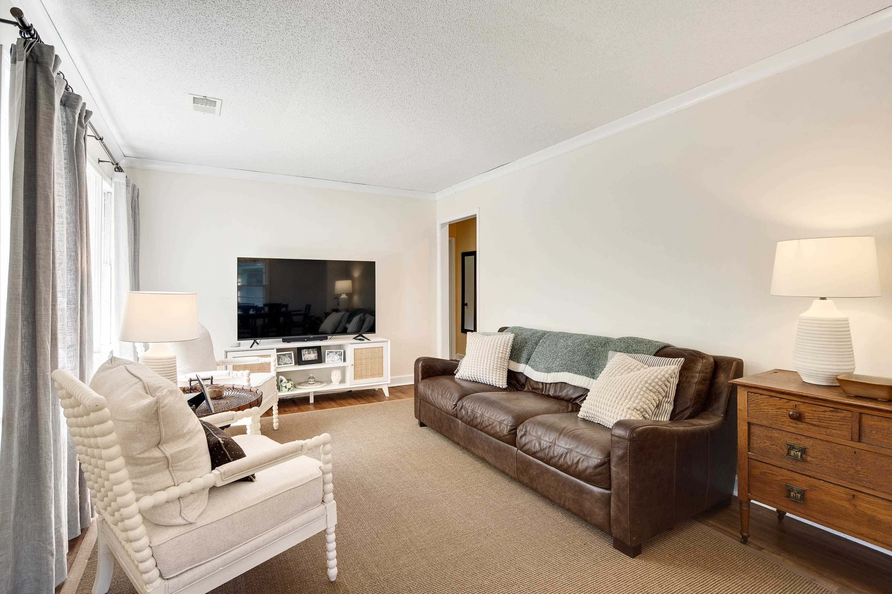 4566 Amboy Road Memphis, TN 38117 - Photo 7 of 29 a living room with furniture and a flat screen tv
