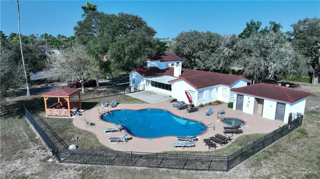 an aerial view of a house with outdoor space