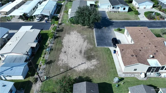 an aerial view of a house with outdoor space
