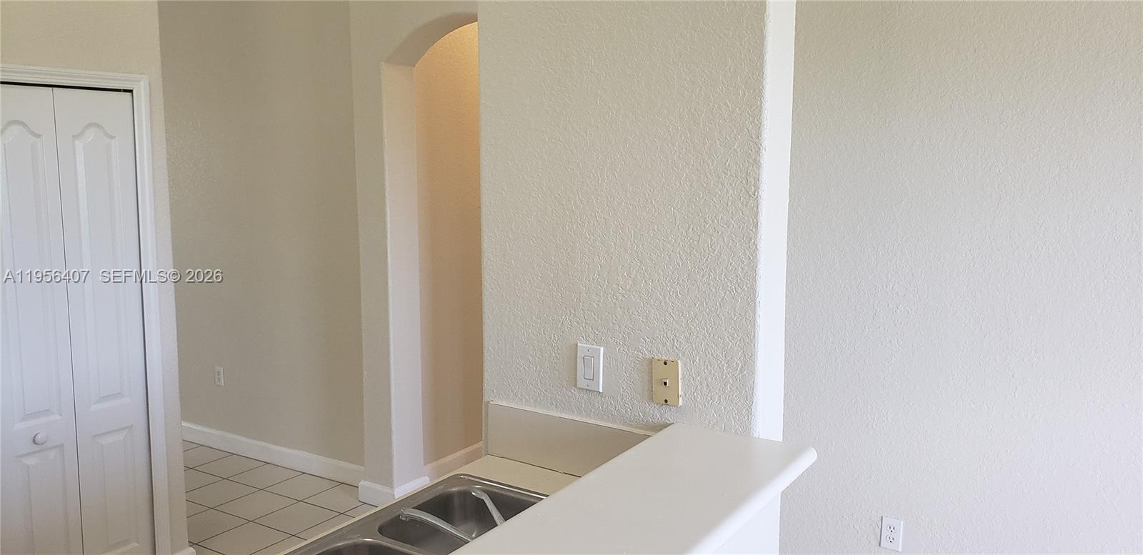 2811 Southeast 17th Avenue, Unit 202 Homestead, FL 33035 - Photo 16 of 71 a view of a hallway with wooden floor