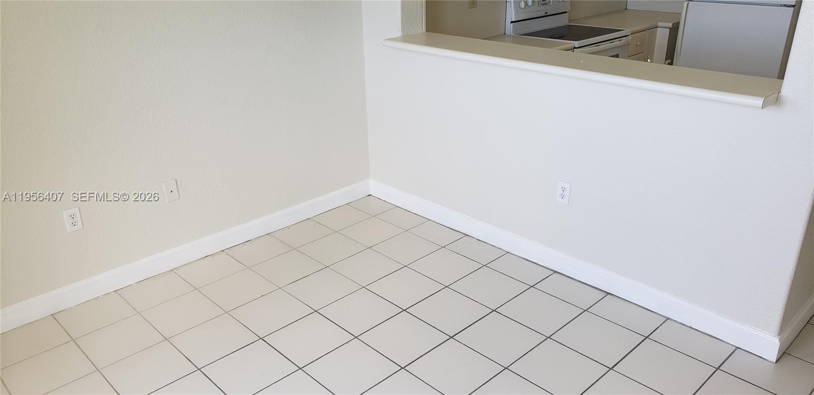 2811 Southeast 17th Avenue, Unit 202 Homestead, FL 33035 - Photo 18 of 71 a view of a refrigerator and window