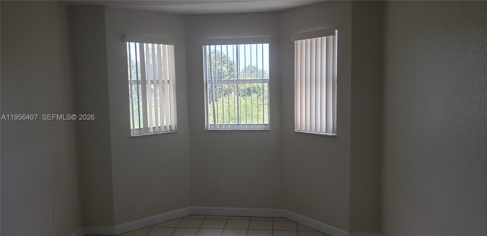 2811 Southeast 17th Avenue, Unit 202 Homestead, FL 33035 - Photo 20 of 71 a view of an empty room with a window