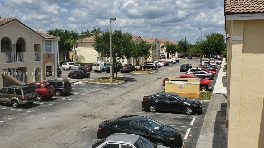 2811 Southeast 17th Avenue, Unit 202 Homestead, FL 33035 - Photo 2 of 71 a view of a street with cars