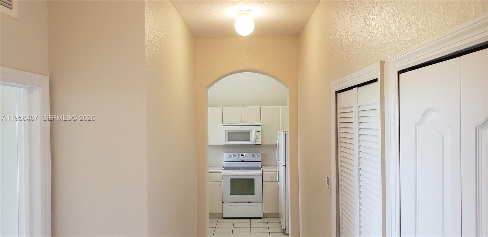2811 Southeast 17th Avenue, Unit 202 Homestead, FL 33035 - Photo 24 of 71 a bathroom with a light fixture and a mirror
