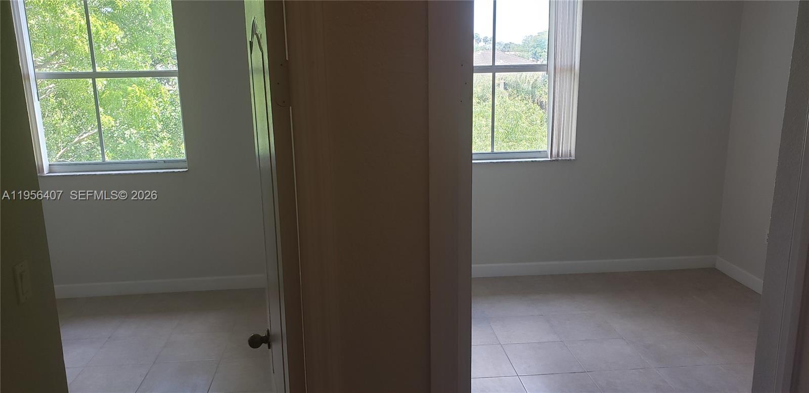 2811 Southeast 17th Avenue, Unit 202 Homestead, FL 33035 - Photo 27 of 71 a view of an empty room with a window
