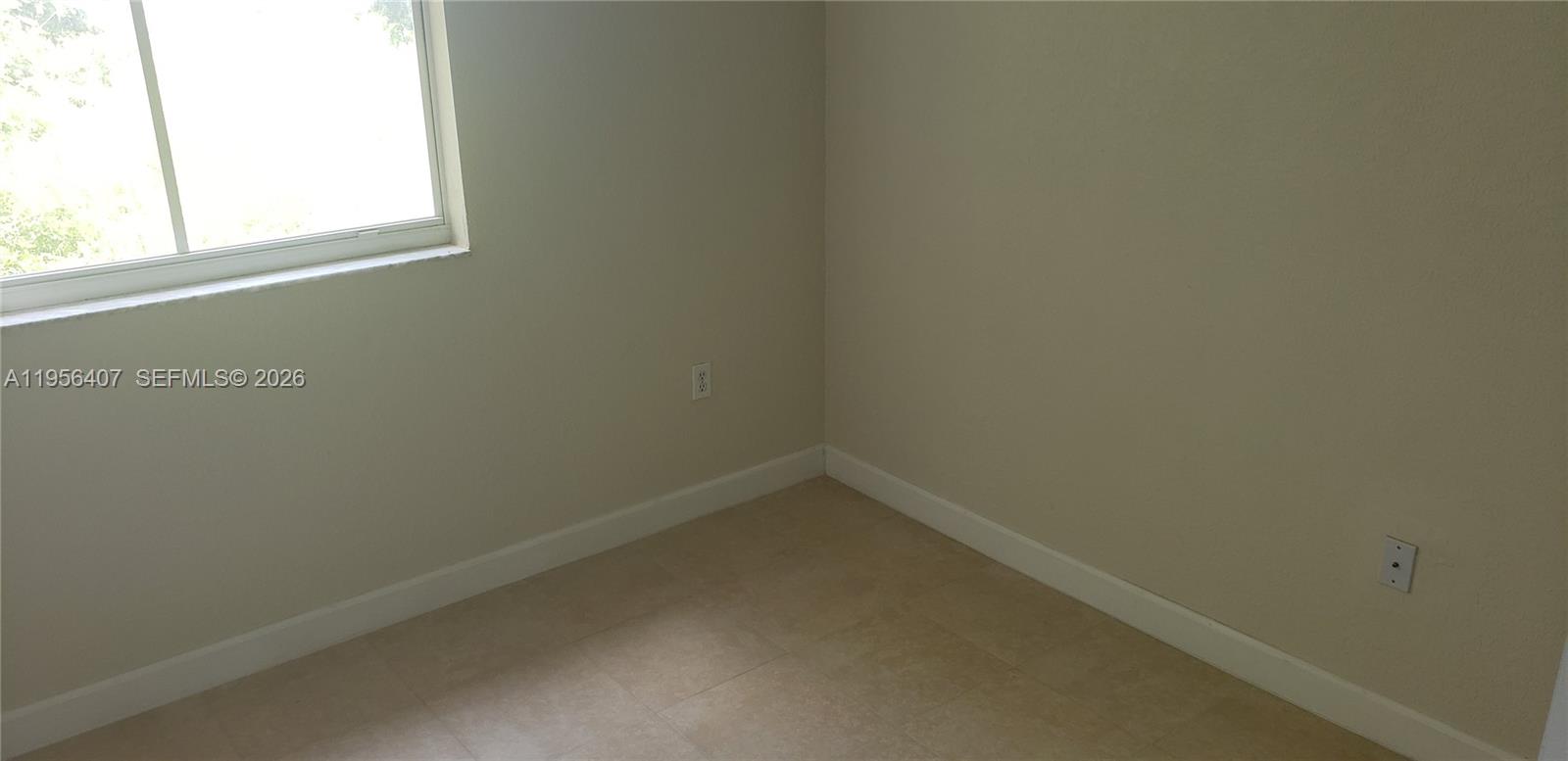 2811 Southeast 17th Avenue, Unit 202 Homestead, FL 33035 - Photo 31 of 71 a small space with a window