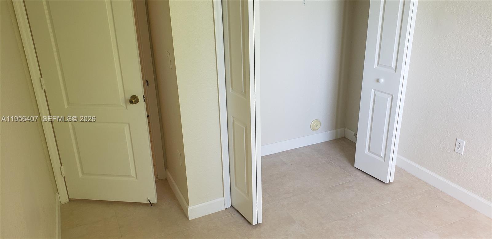 2811 Southeast 17th Avenue, Unit 202 Homestead, FL 33035 - Photo 32 of 71 a view of a room with door