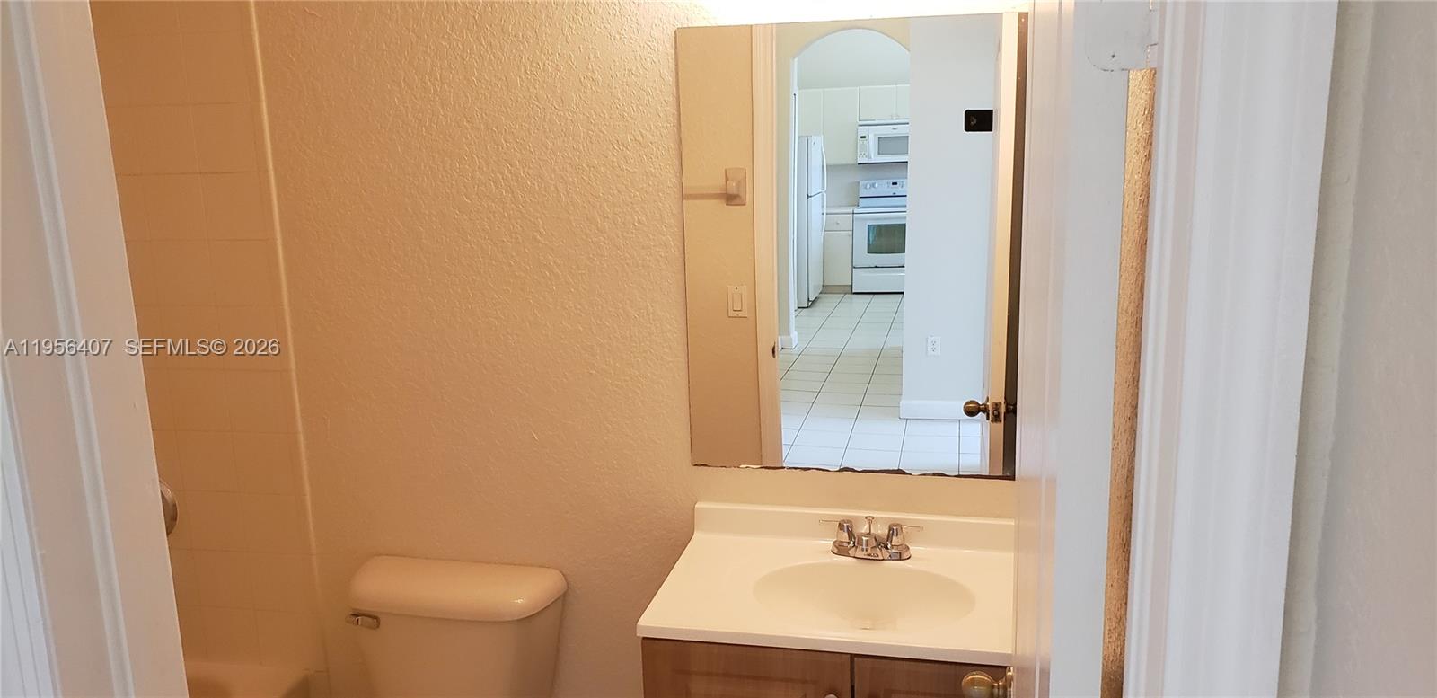 2811 Southeast 17th Avenue, Unit 202 Homestead, FL 33035 - Photo 35 of 71 a bathroom with a sink and a mirror