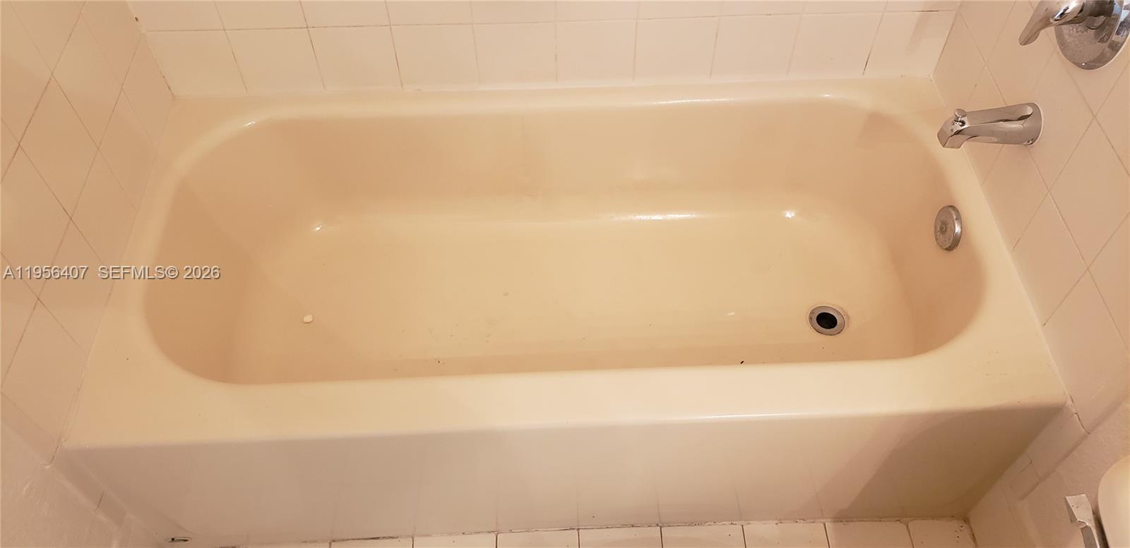 2811 Southeast 17th Avenue, Unit 202 Homestead, FL 33035 - Photo 37 of 71 a bathroom with a bathtub