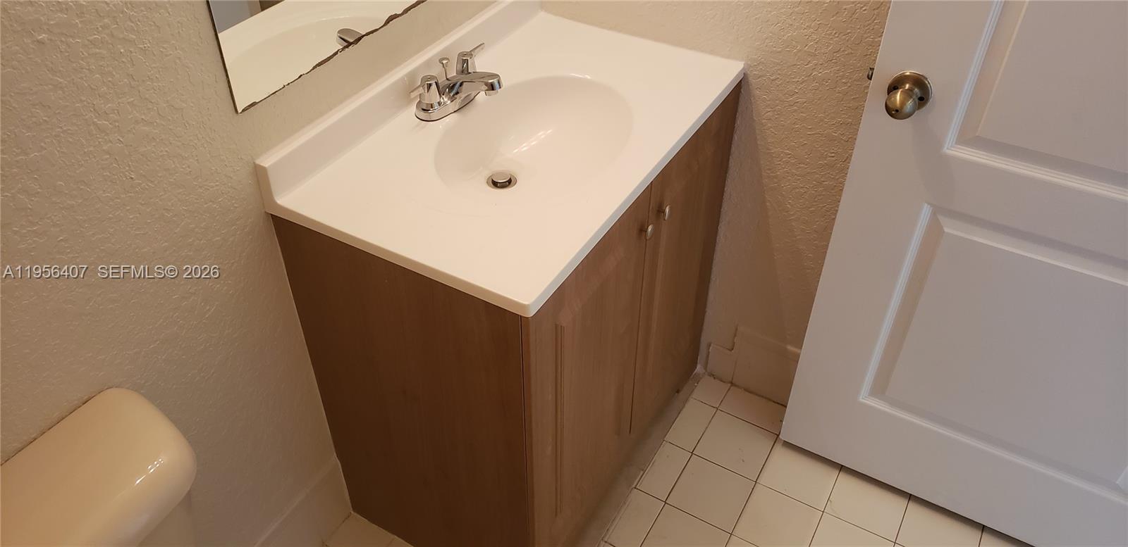 2811 Southeast 17th Avenue, Unit 202 Homestead, FL 33035 - Photo 41 of 71 a bathroom with a sink and shower