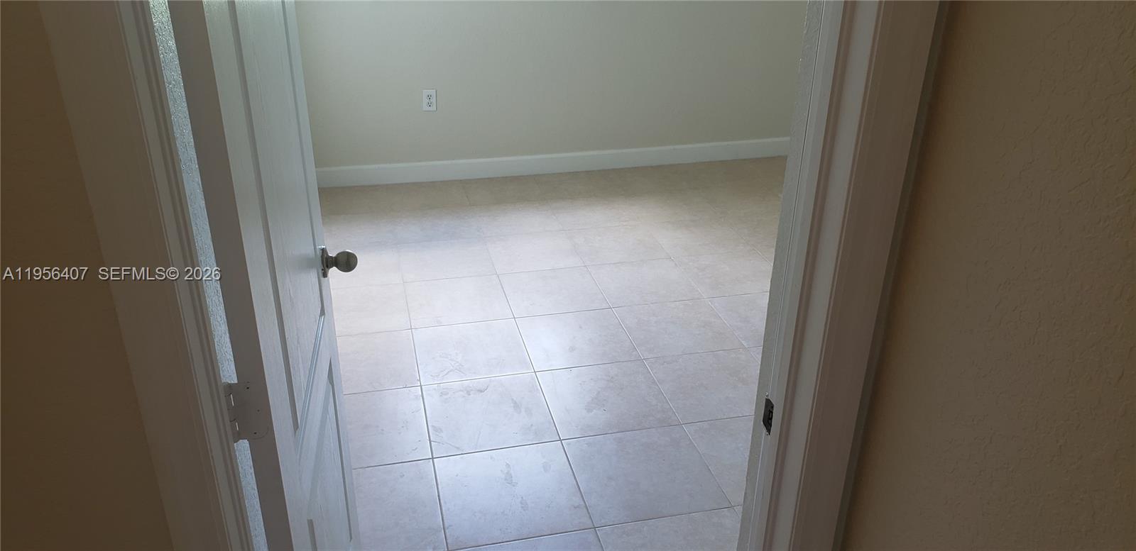 2811 Southeast 17th Avenue, Unit 202 Homestead, FL 33035 - Photo 43 of 71 a bathroom with a glass door shower