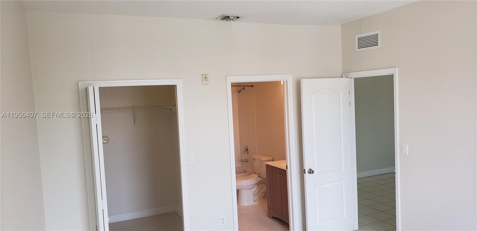 2811 Southeast 17th Avenue, Unit 202 Homestead, FL 33035 - Photo 56 of 71 a view of a bathroom with a sink mirror and shower