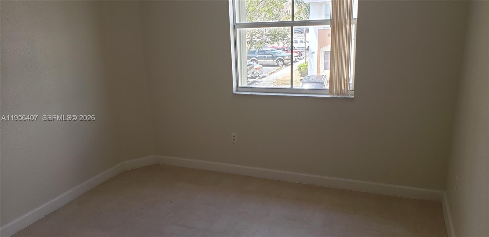 2811 Southeast 17th Avenue, Unit 202 Homestead, FL 33035 - Photo 57 of 71 an empty room with a window