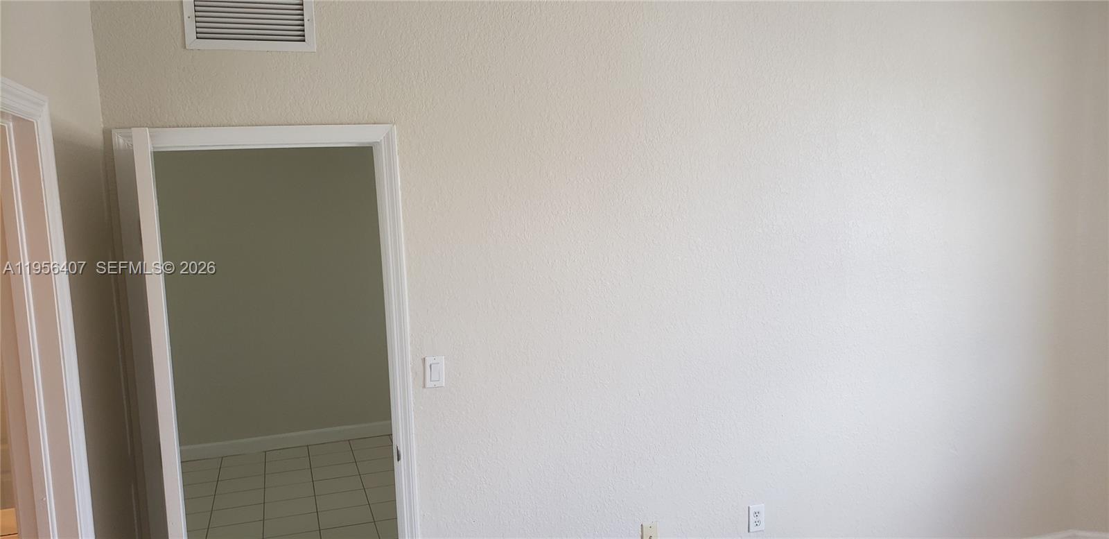 2811 Southeast 17th Avenue, Unit 202 Homestead, FL 33035 - Photo 58 of 71 a view of a hallway