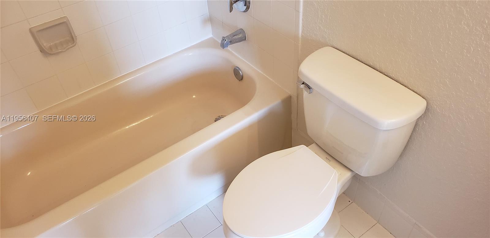 2811 Southeast 17th Avenue, Unit 202 Homestead, FL 33035 - Photo 65 of 71 a bathroom with a toilet and bathtub