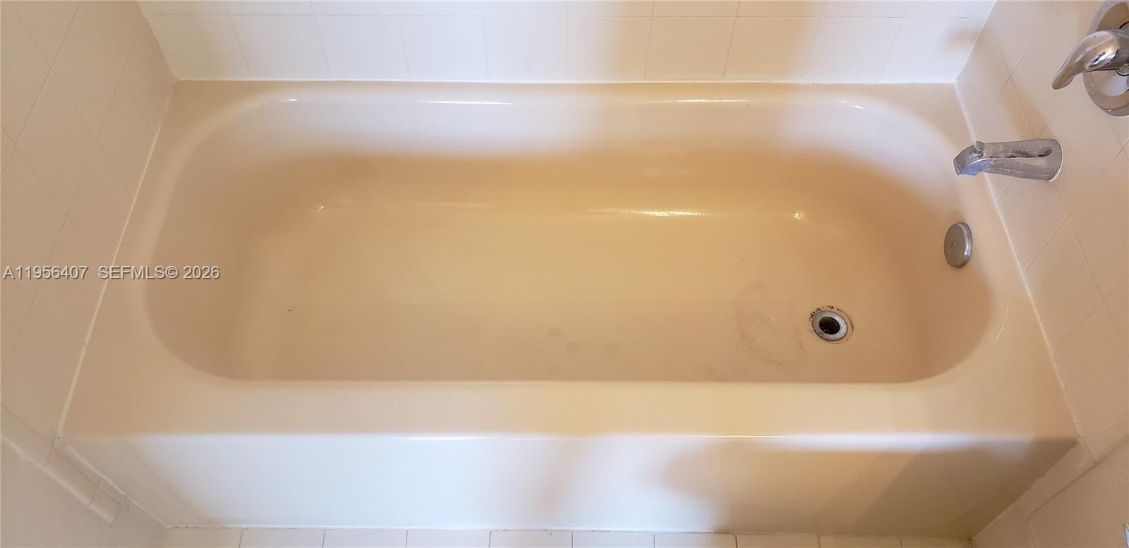 2811 Southeast 17th Avenue, Unit 202 Homestead, FL 33035 - Photo 66 of 71 a bathroom with a bathtub