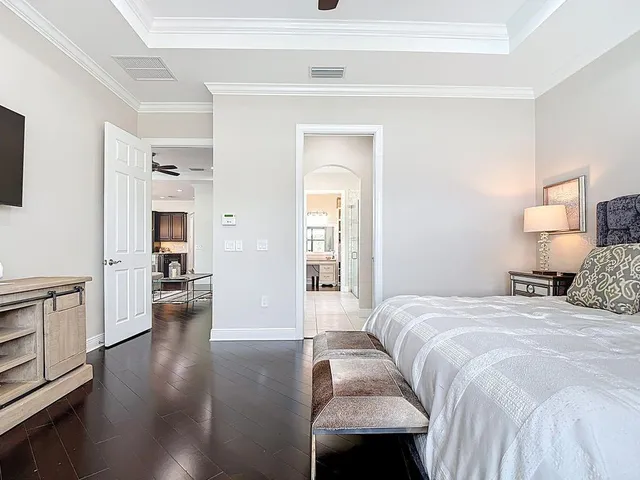 a bathroom with a granite countertop sink a mirror and a bathtub