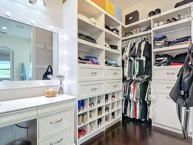 a kitchen with stainless steel appliances granite countertop wooden cabinets granite counter tops and a stove