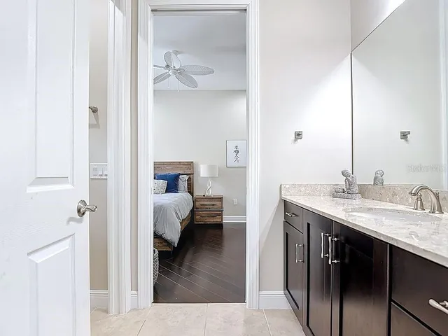 a white toilet sitting next to a bathroom sink