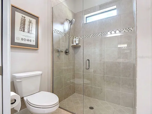 a dining room with table a window and wooden floor