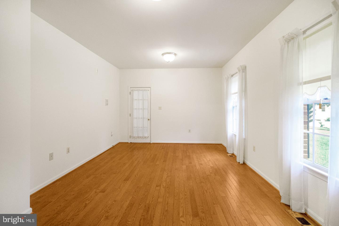 13814 West End Farm Road Upper Marlboro, MD 20772 - Photo 13 of 15 an empty room with wooden floor and windows