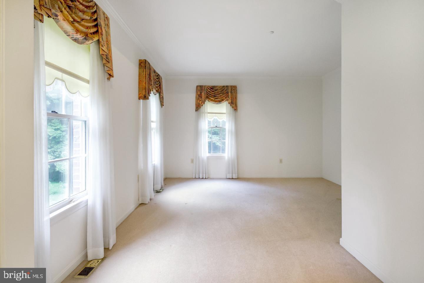 13814 West End Farm Road Upper Marlboro, MD 20772 - Photo 2 of 15 a view of an empty room with a window