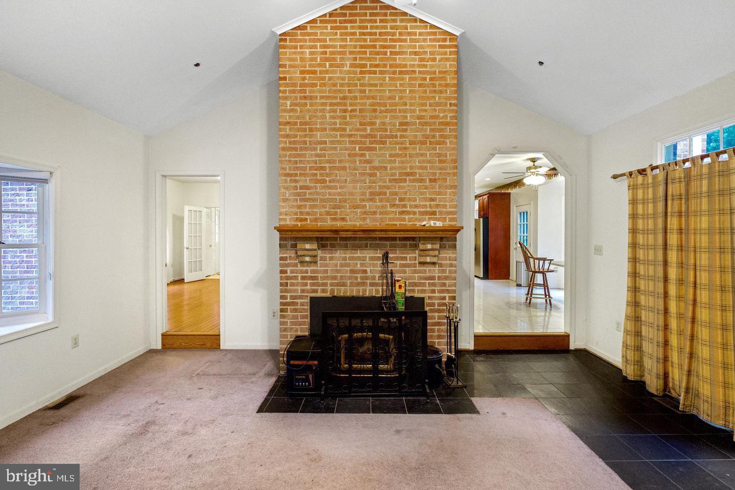 13814 West End Farm Road Upper Marlboro, MD 20772 - Photo 7 of 15 a living room with furniture and a fireplace
