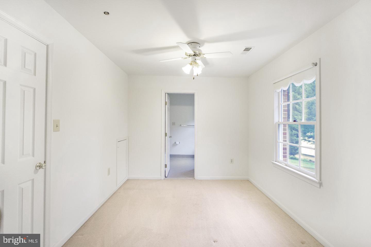 13814 West End Farm Road Upper Marlboro, MD 20772 - Photo 9 of 15 an empty room with windows and cabinet