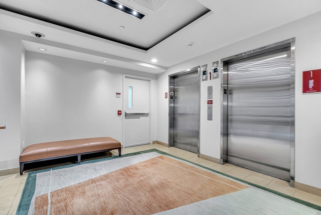 17 Otis Street, Unit 602 Cambridge, MA 02141 - Photo 19 of 40 a room with a walk in closet and window