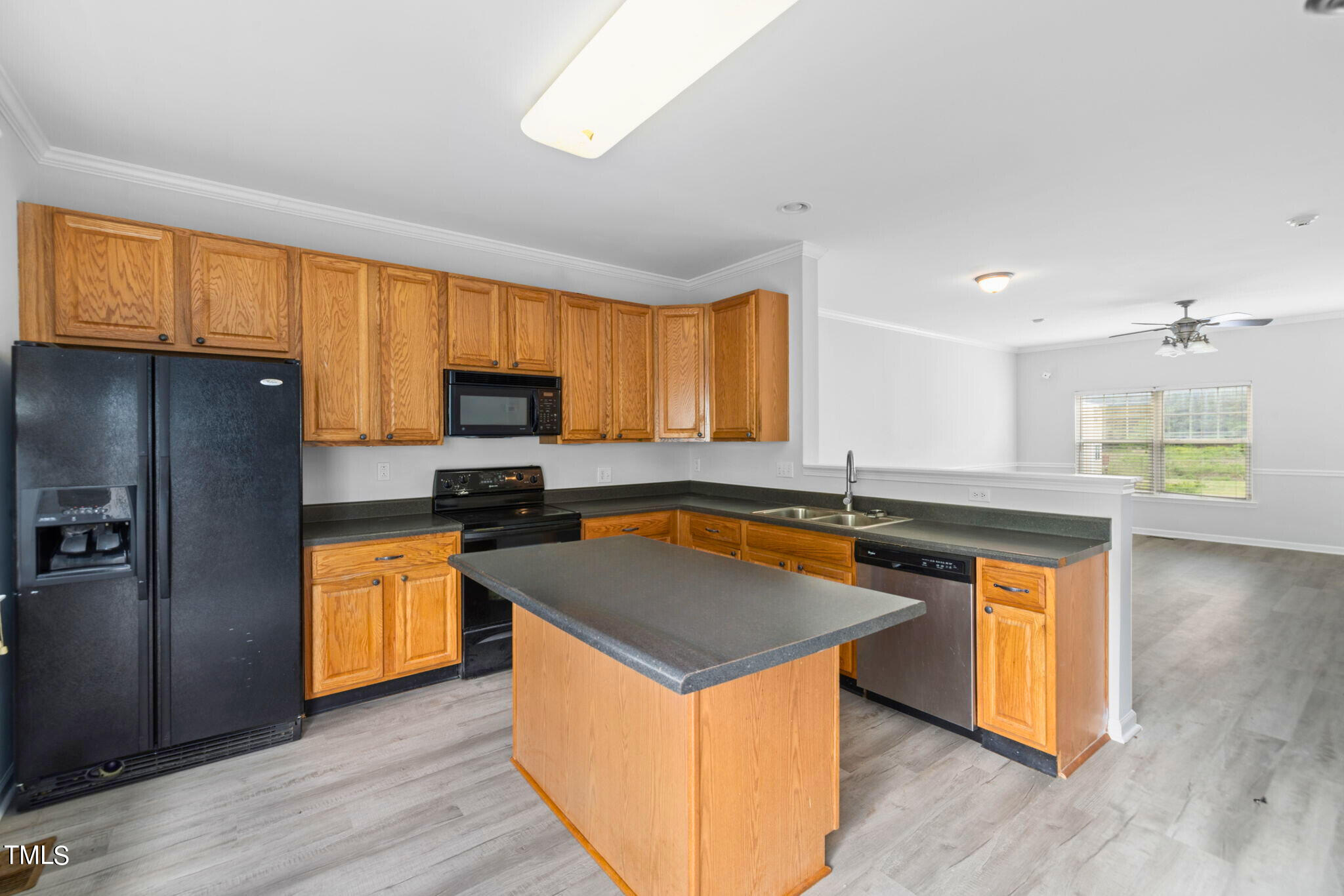 1237 Stone Manor Drive Raleigh, NC 27610 - Photo 14 of 29 a kitchen with stainless steel appliances granite countertop a stove a sink and a refrigerator