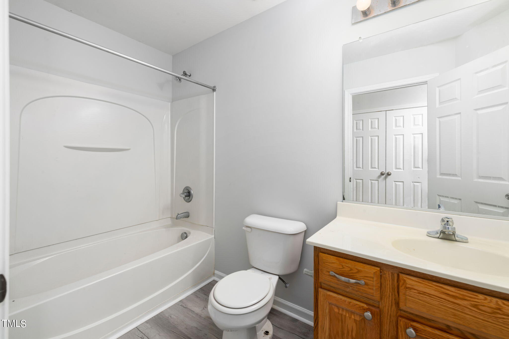 1237 Stone Manor Drive Raleigh, NC 27610 - Photo 22 of 29 a bathroom with a sink a toilet and shower