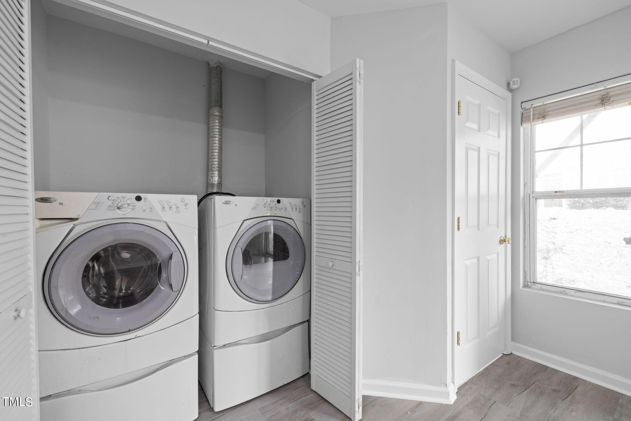 1237 Stone Manor Drive Raleigh, NC 27610 - Photo 24 of 29 a utility room with dryer and washer