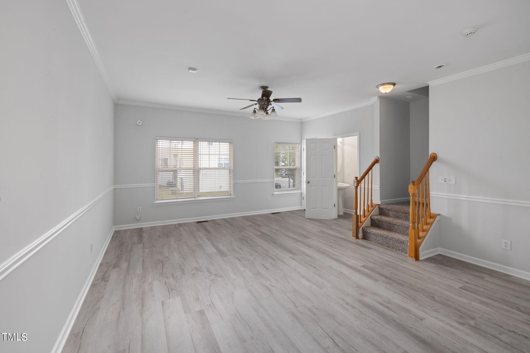 1237 Stone Manor Drive Raleigh, NC 27610 - Photo 9 of 29 wooden floor in an empty room with a window