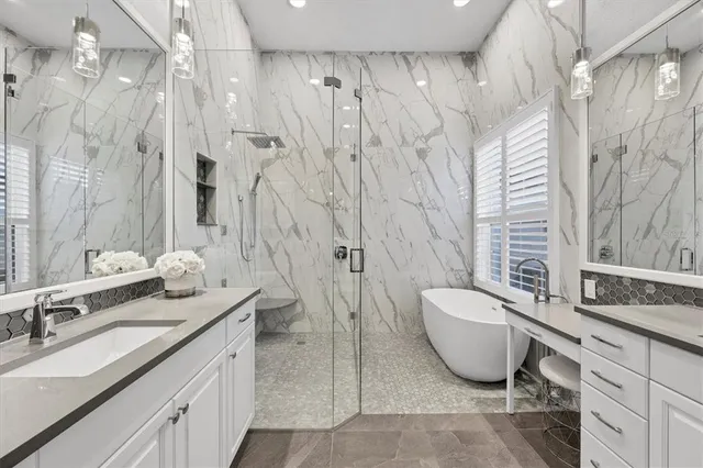 a bathroom with a shower and vanity