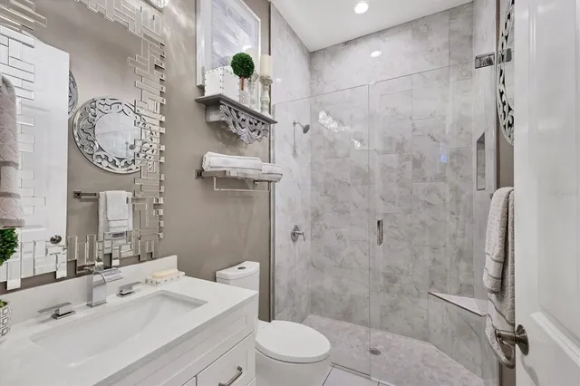 a bedroom with a large bed and a large window