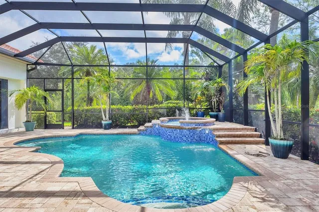 a view of a house with backyard porch and sitting area