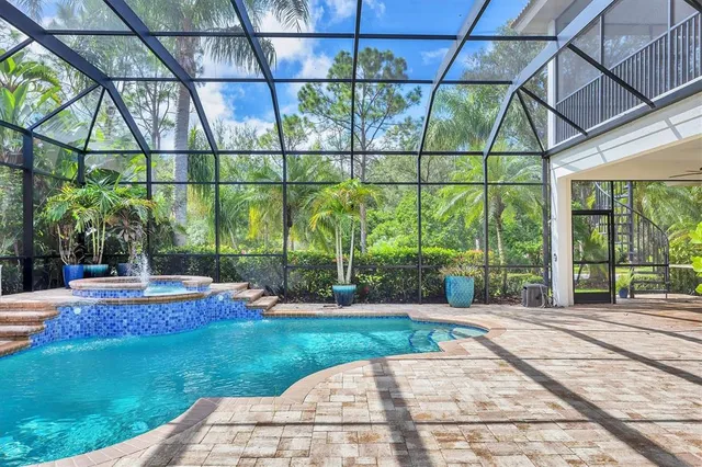 a view of a kitchen area with furniture and floor to ceiling window