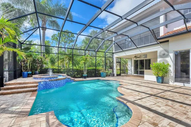 a swimming pool with yard in front of it