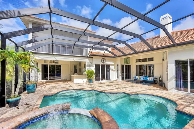 a view of a backyard with pool table and chairs