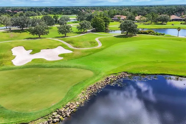 a view of a swimming pool with an outdoor seating