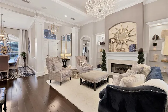 a view of a dining room with furniture wooden floor and chandelier