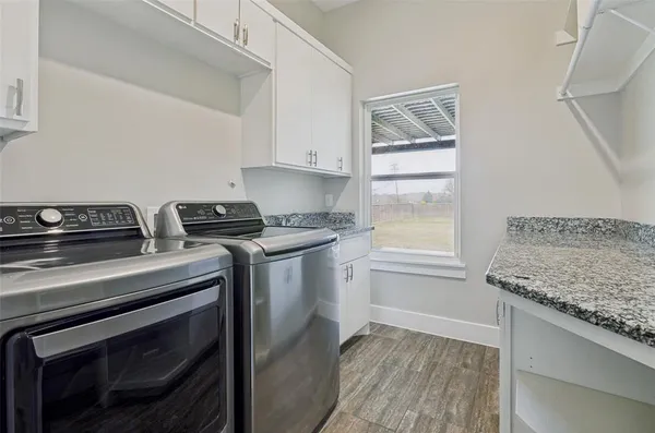 a kitchen with a stove microwave and sink