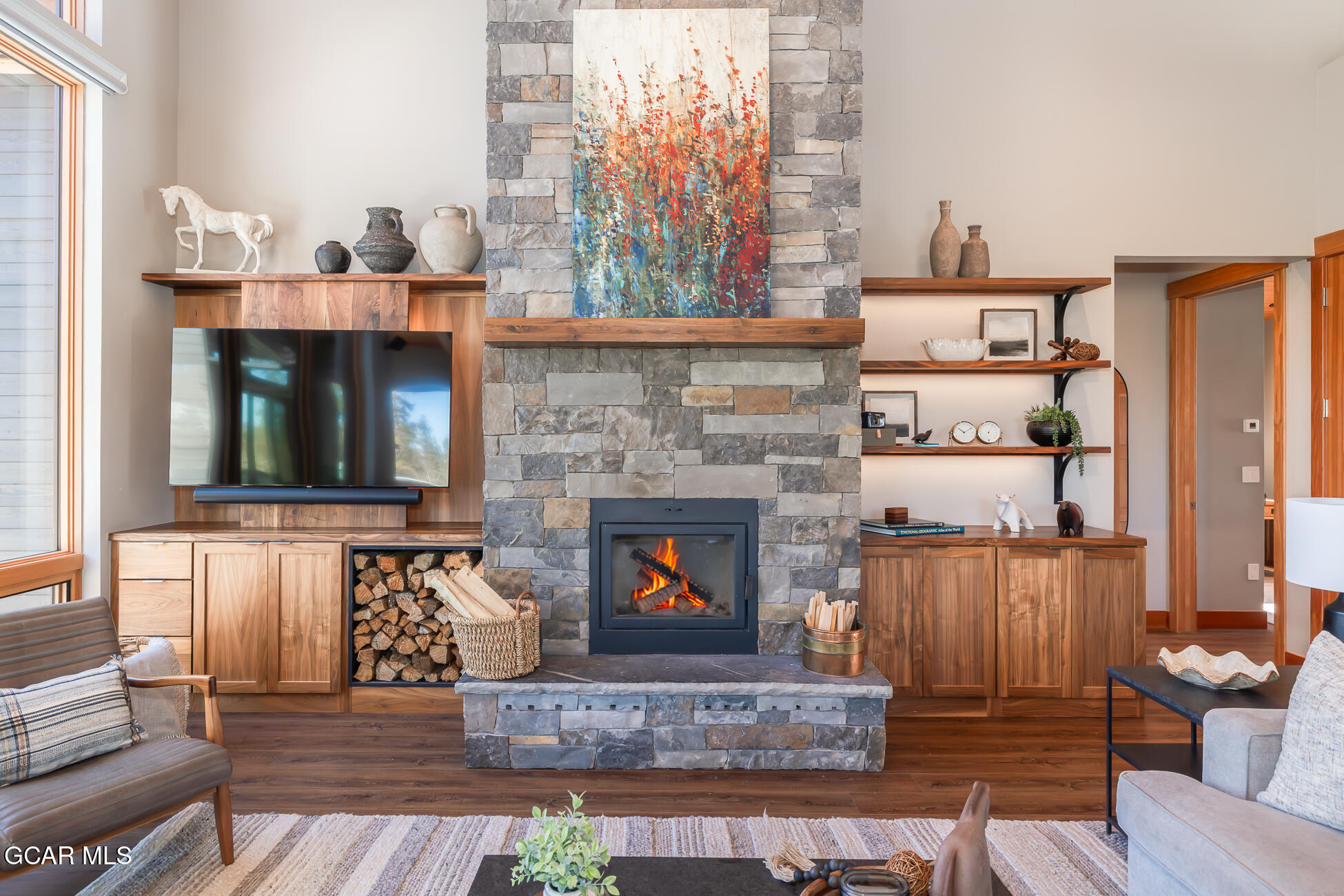 684 Vasquez Road Winter Park, CO 80482 - Photo 5 of 45 a living room with furniture and a fireplace