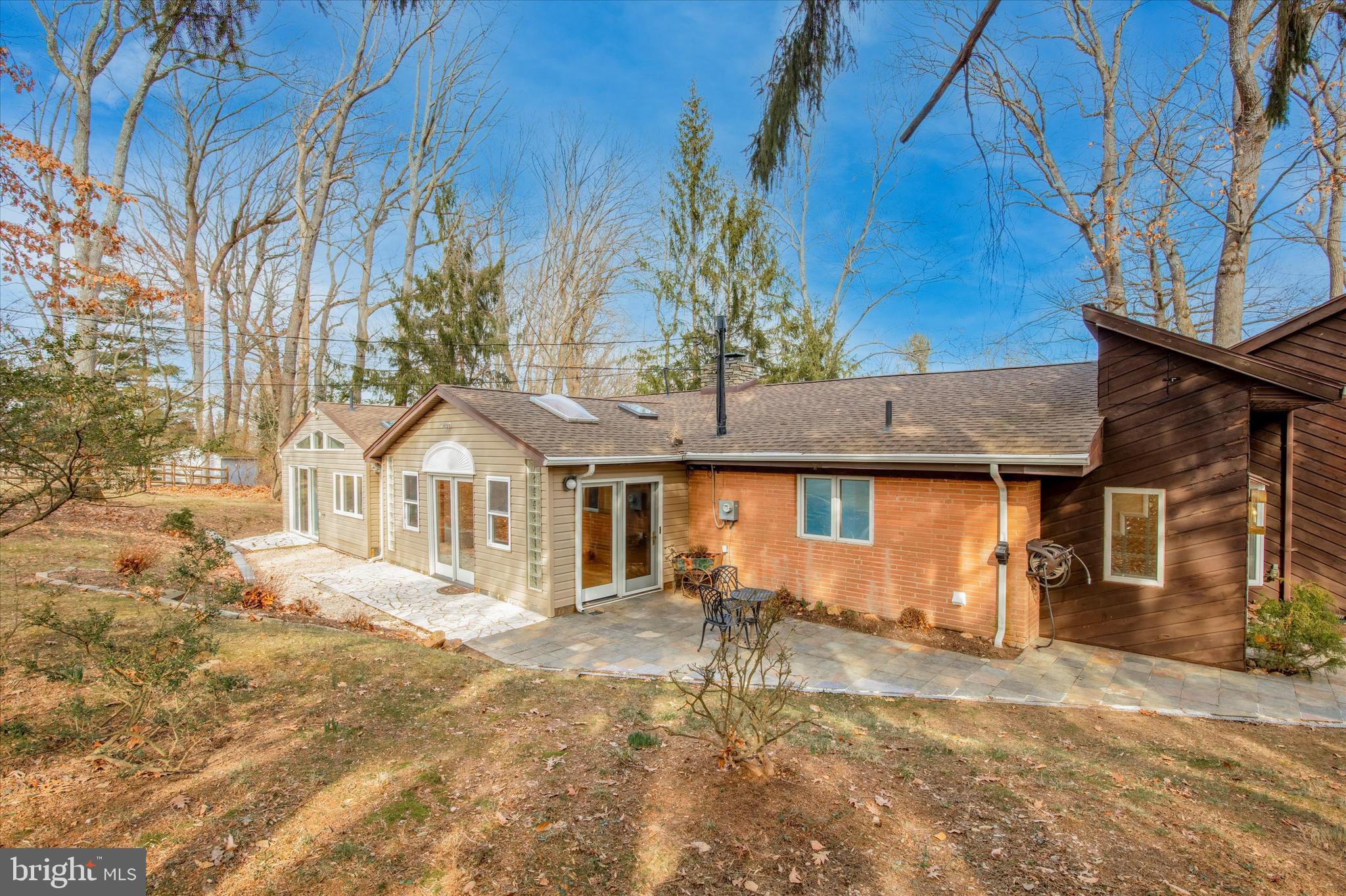 455 Sharon Drive Wayne, PA 19087 - Photo 6 of 36 Left side of home, entertaining area