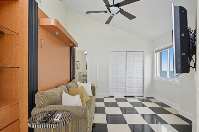 a bedroom with furniture and a window