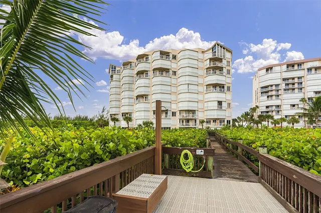 a view of a balcony with chairs