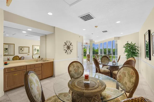 a living room with furniture a rug and white walls